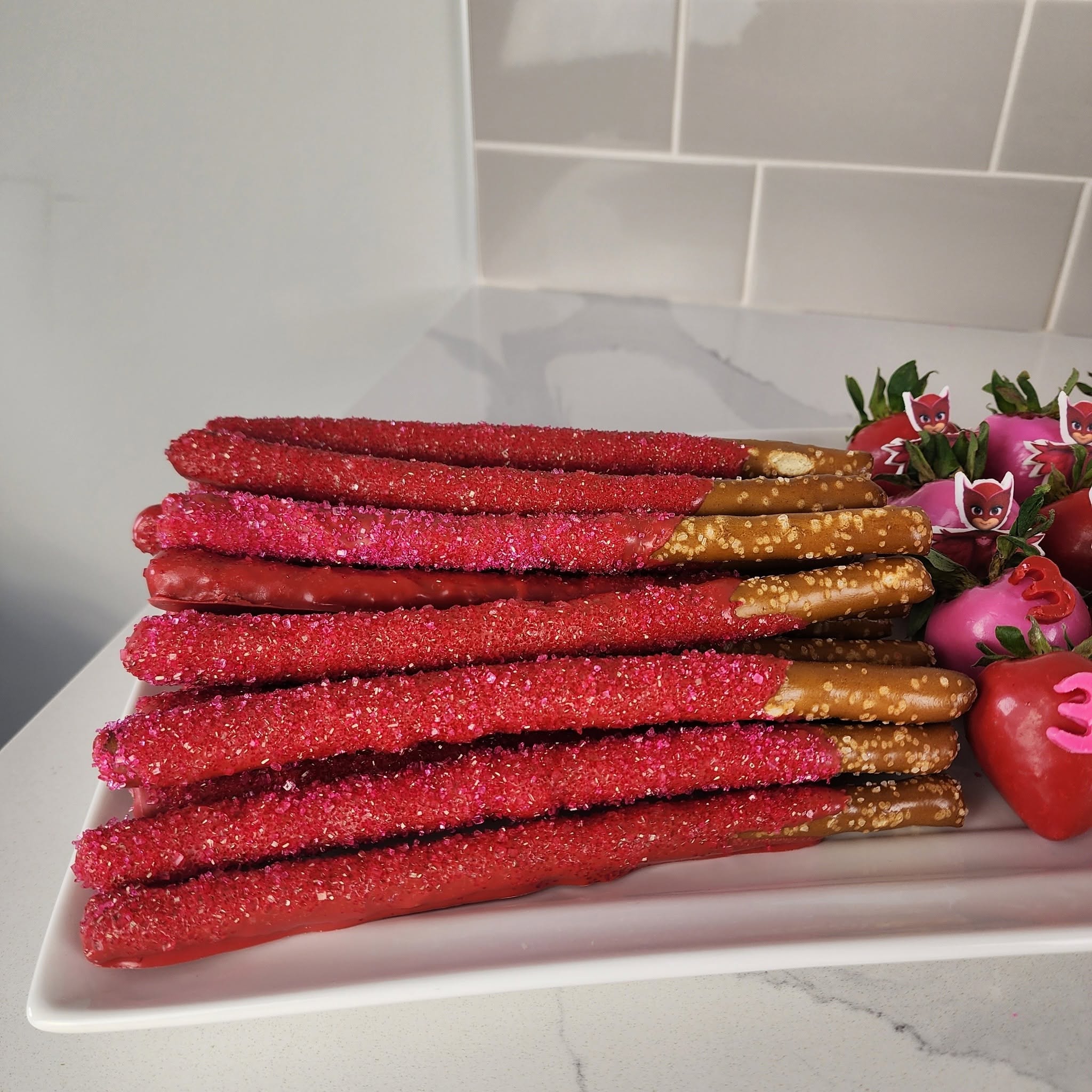 Pink chocolate-covered pretzel rods