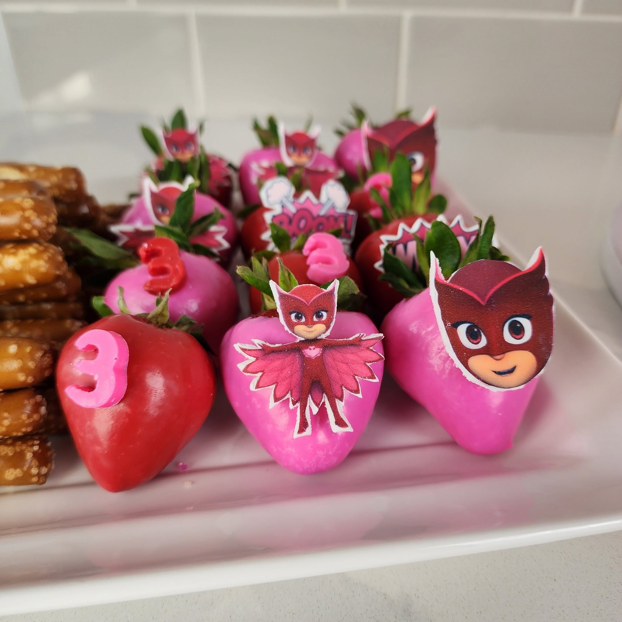 Character-themed chocolate-covered strawberries