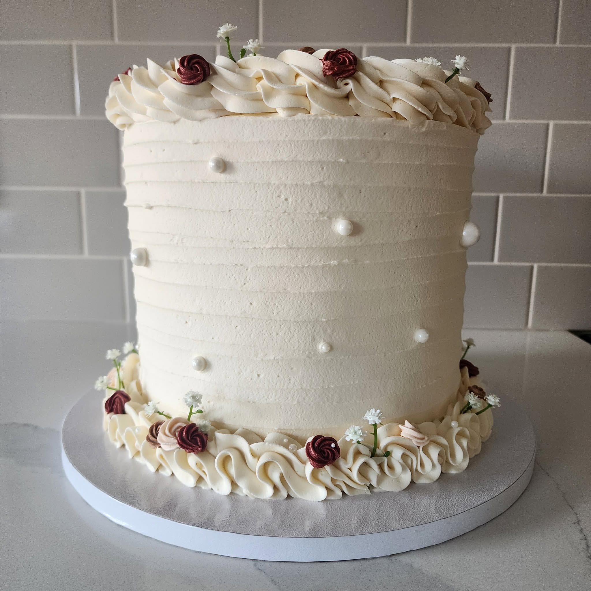 Elegant tiered wedding cake by Tacouri Cuisine