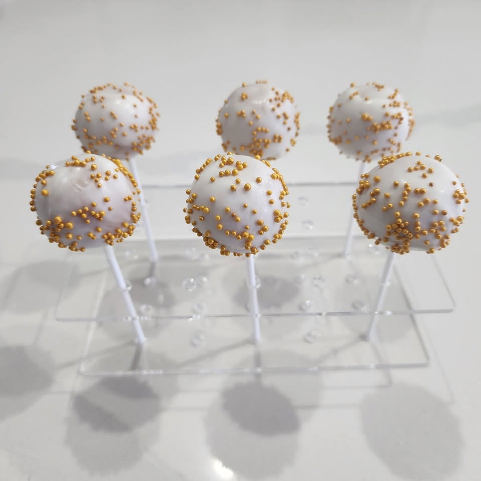 Celebration cake pops with custom decorations