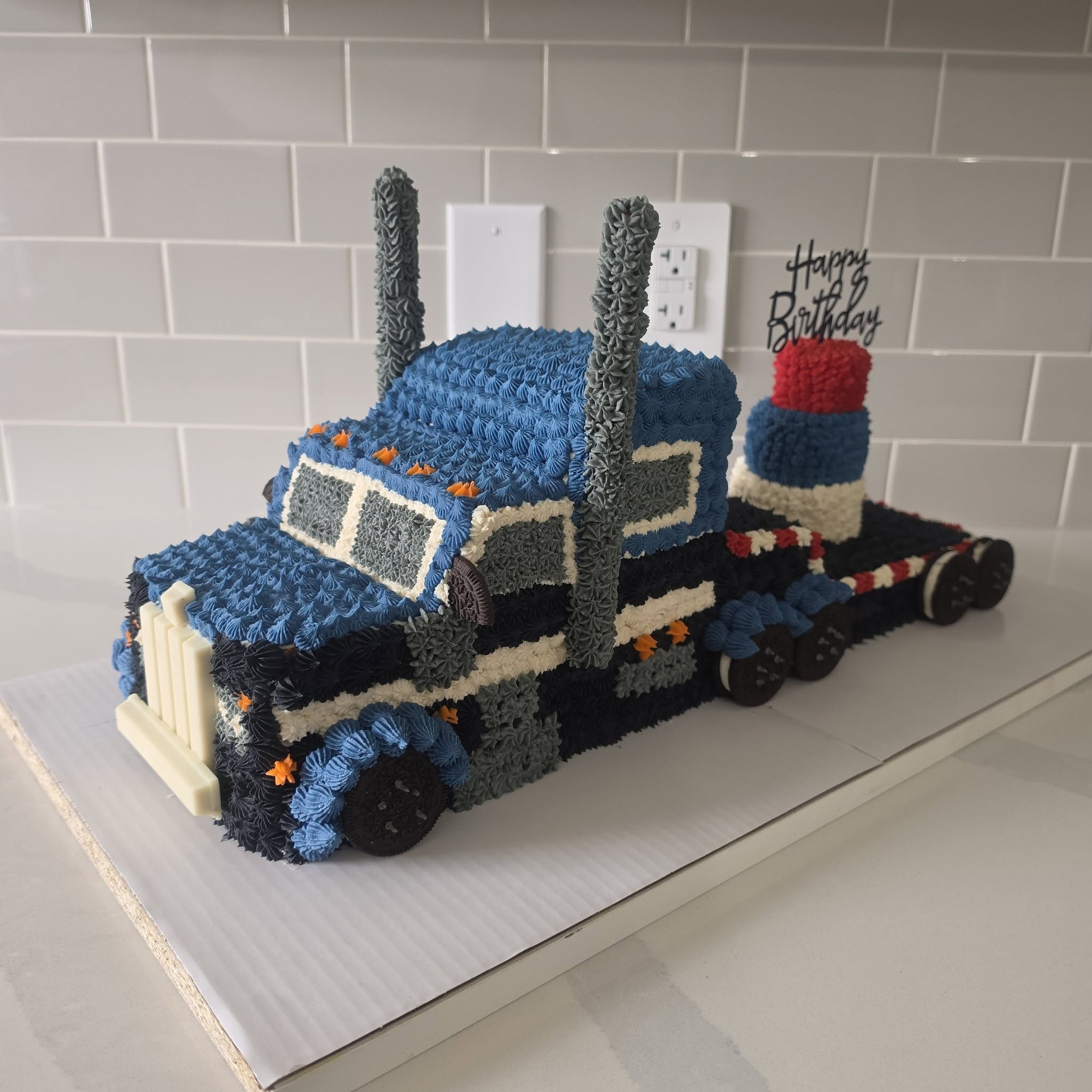 Blue semi-truck themed birthday cake