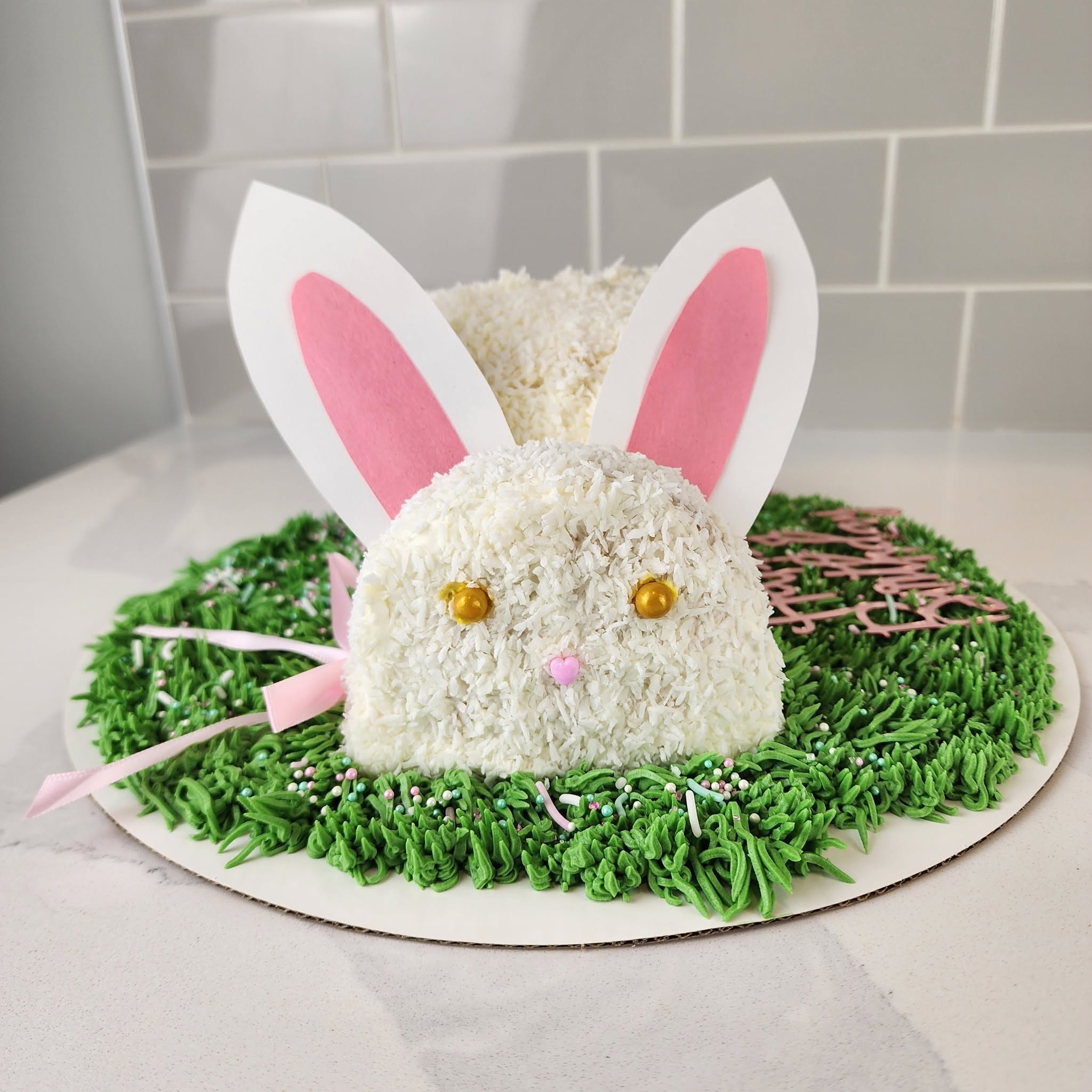 Bunny-shaped coconut cake on piped green grass