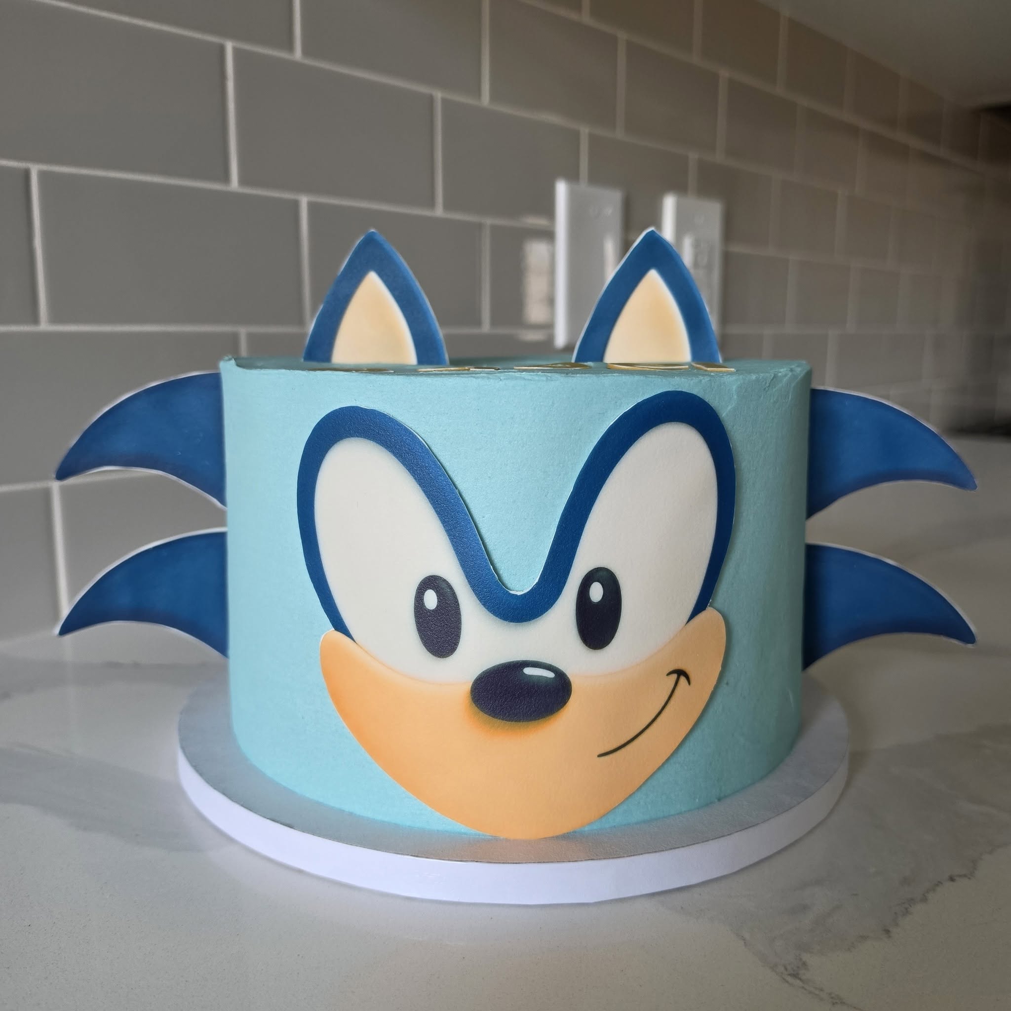 Blue character-themed birthday cake